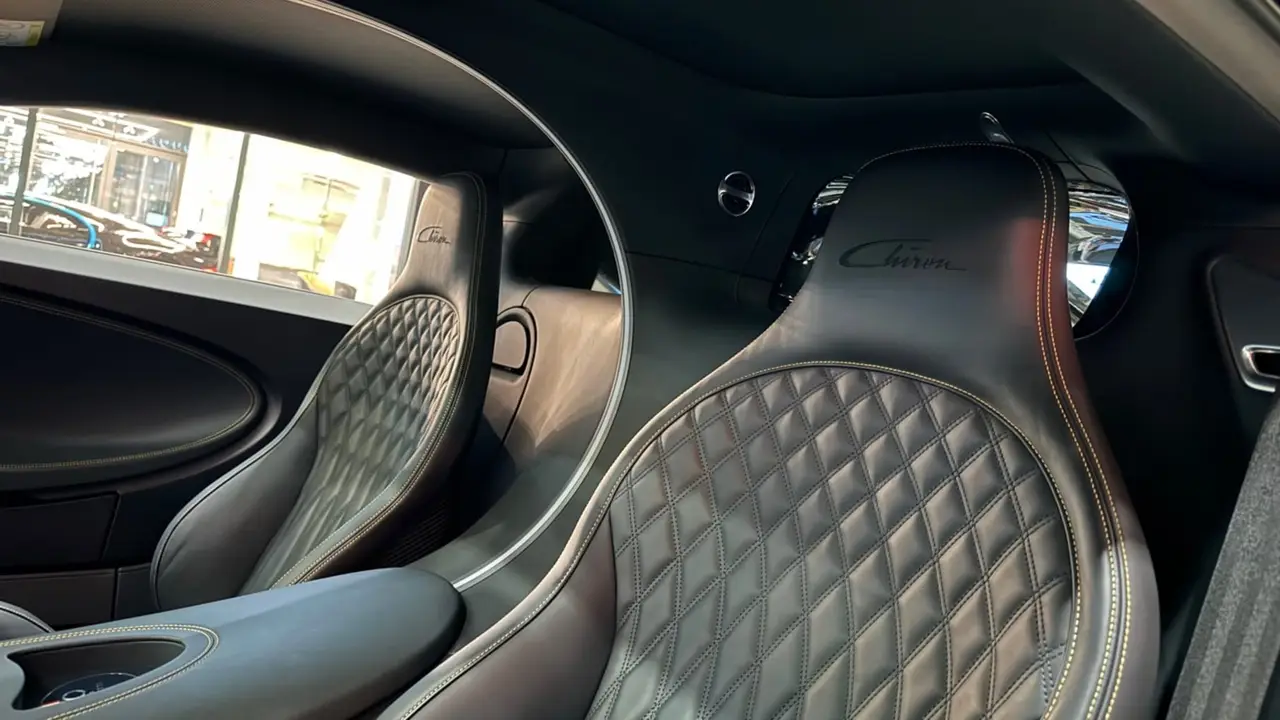 Bugatti Chiron 110 Ani 2019, interior — Zurich Luxury Car Rental, Zurich. Bugatti Chiron 110 Ani in Zurich The Bugatti Chiron 110 Ani, dated 2019, is available for…