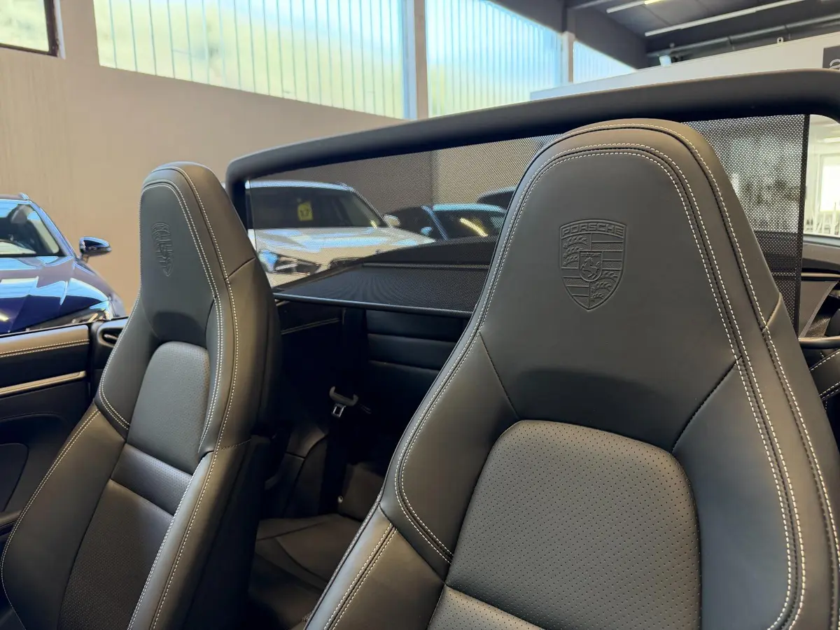 Porsche 911 Carrera S Cabrio (992) 2025, rear view — Zurich Luxury Car Rental, Zurich. Porsche 911 Carrera S Cabrio (992) in Zurich The Porsche 911 Carrera S Cabrio (992) is…