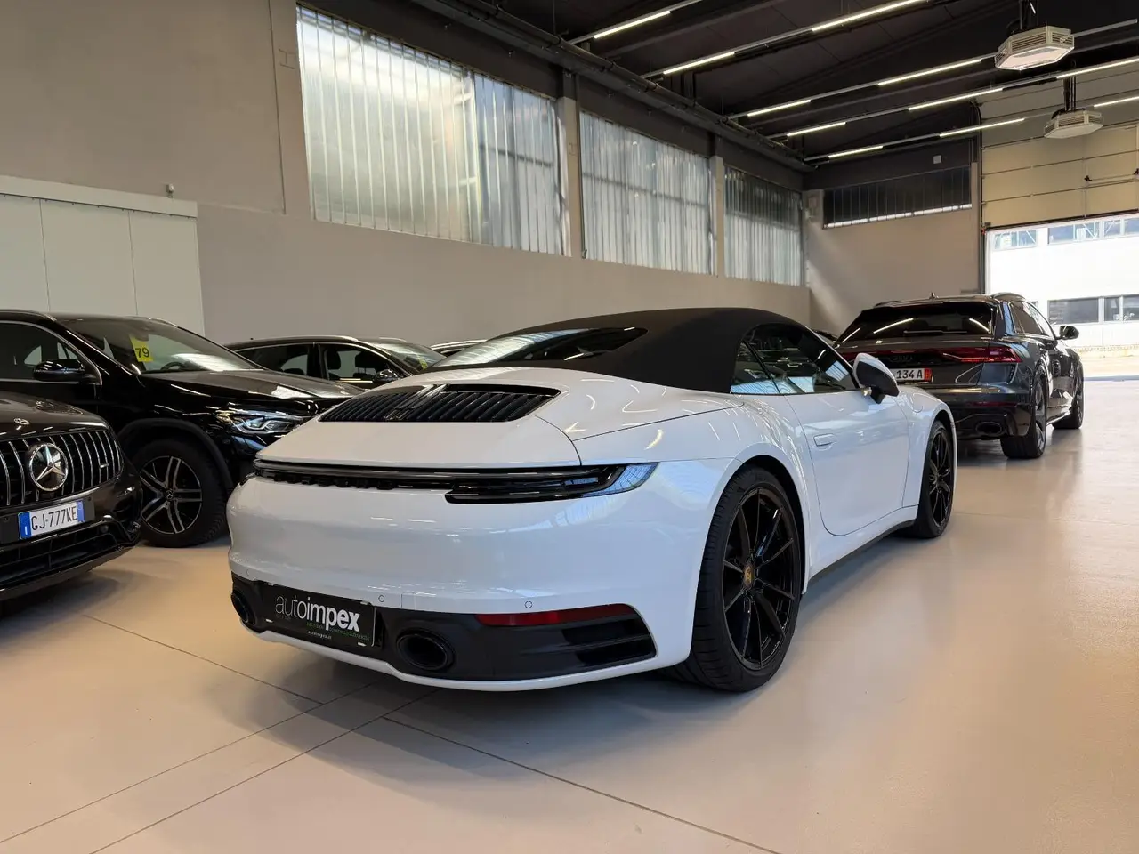 Porsche 911 Carrera S Cabrio (992) 2025, side profile — Zurich Luxury Car Rental, Zurich. Porsche 911 Carrera S Cabrio (992) in Zurich The Porsche 911 Carrera S Cabrio (992) is…